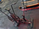 a stationary exercise bike on the floor in a gym