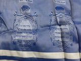 a blue and white towel with a picture of a man and a woman on it