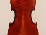 an old violin with a wooden back and a long neck