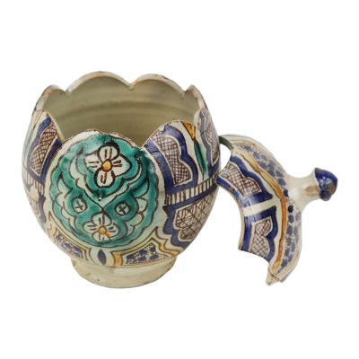 an image of a decorative vase with a flower on it