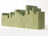a green bookend that has a picture of a city on it