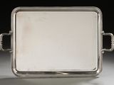 an antique silver tray with handles and handles on a white surface