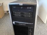 a computer tower with a hard drive on top of it