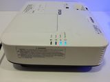 an image of a white projector sitting on top of a white table