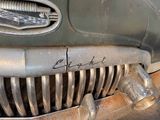 a close up of a car ' s grille with the name of a person on it