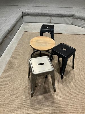 three stools and a table in a room