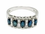 a close up of a ring with blue and white diamonds