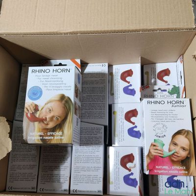 a cardboard box full of toothbrushes and toothpaste