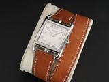a watch that is sitting on a piece of cloth