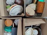 two boxes with different items in them on the floor