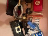 a picture of a bathroom sink with a lot of items on it