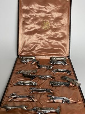 a case that has a bunch of silver spoons in it