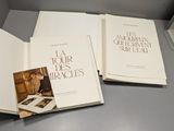 three books that are sitting on a table