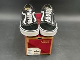 vans old skooler black and white sneakers in a box