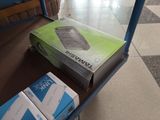 two boxes of toilet paper sitting on a cart