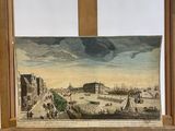 a painting on an easel with a painting of a city in the background