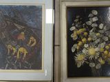 two framed pictures of flowers in a vase on the wall