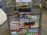 a metal cart with many items in it in a warehouse