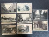 several old black and white photographs of a street and buildings