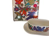 a bowl and plate with a bird design on it