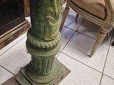 a statue of a woman sitting on top of a pedestal