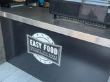 an image of a restaurant counter with a sign on it