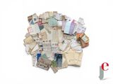 a pile of old letters and papers on a white surface
