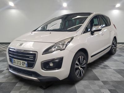 the small white car is parked in a large room