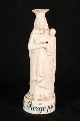 an image of a statue of a woman holding a child