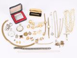 many different types of jewelry on a white surface