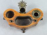 a small wooden box with two holes in it