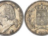 a close up of a coin with a crown on it