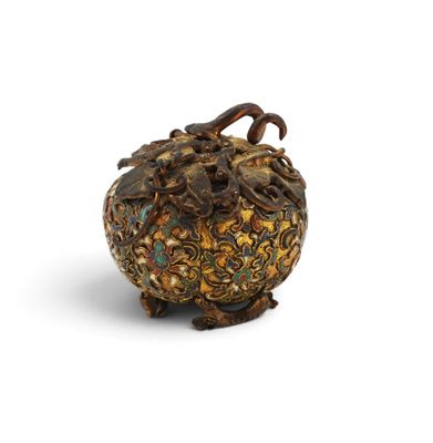 an image of a gold and green vase on a white surface
