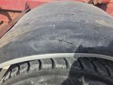 a close up of a tire on the back of a truck