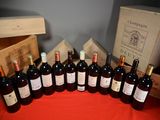 many bottles of wine sitting on a table next to a box