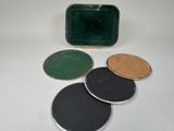 several different colored coasters sitting on top of a white table