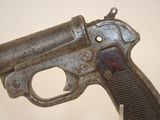 an old gun that is on display on a table