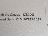 a close up picture of a computer keyboard with the canadian ice - 003 logo on it