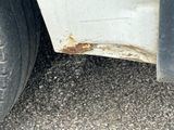 a close up of a dirty tire on the ground