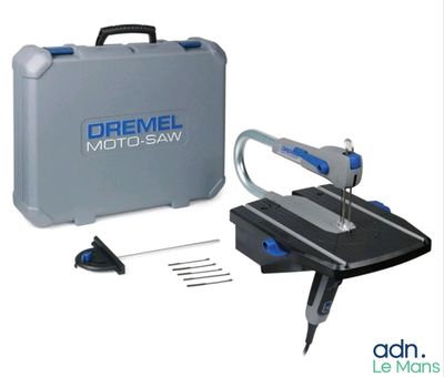 the dremel moto saw is being used to cut a piece of wood