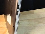 a laptop sitting on a table with a black background
