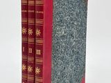 two books that are sitting side by side on a white surface