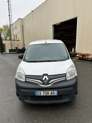a white van parked in front of a building