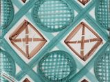 a close up of a blue and brown plate with a design on it