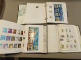a lot of stamps on the pages of a book