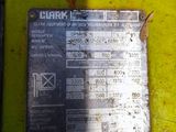 a close up of a metal plate on a yellow machine