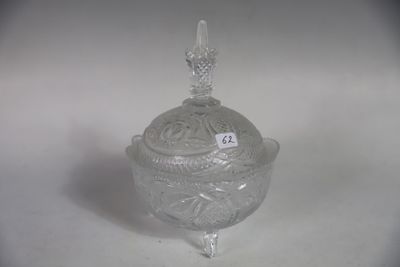 a glass container with a lid on a white surface