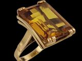 an image of a gold ring with a large citrine stone
