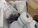 many rolls of toilet paper in a box on the floor