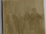 an old photo of a group of men posing for a picture